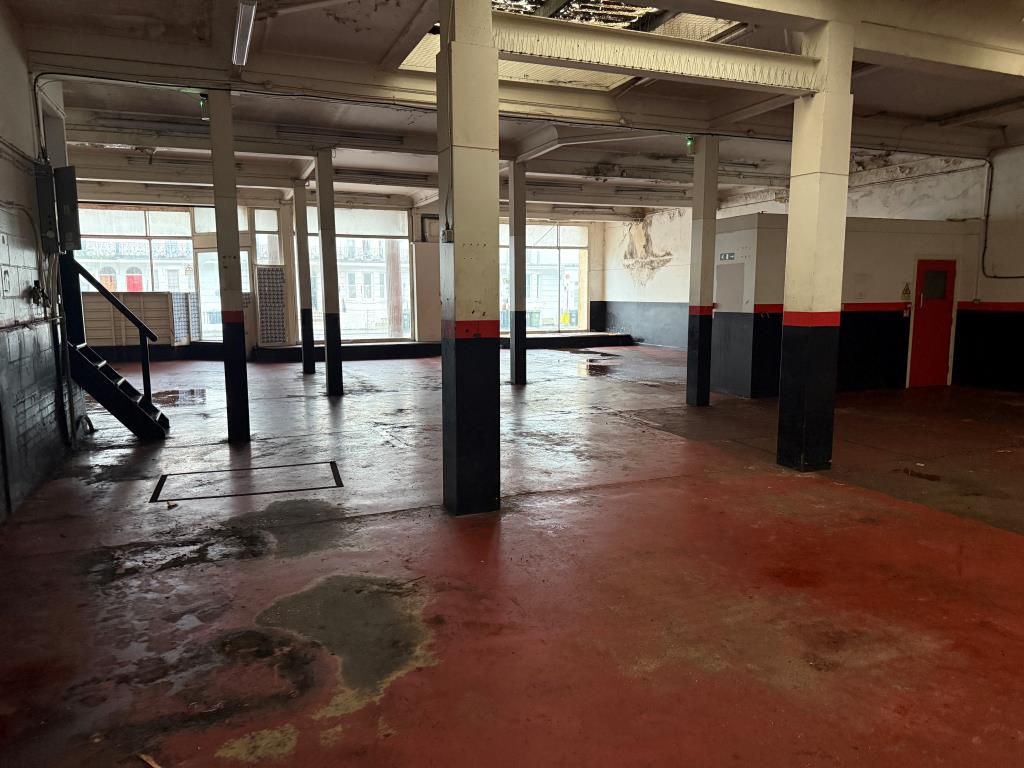 Lot: 24 - FORMER SHOWROOM WITH DEVELOPMENT POTENTIAL (STNC) - Internal view from rear left of building